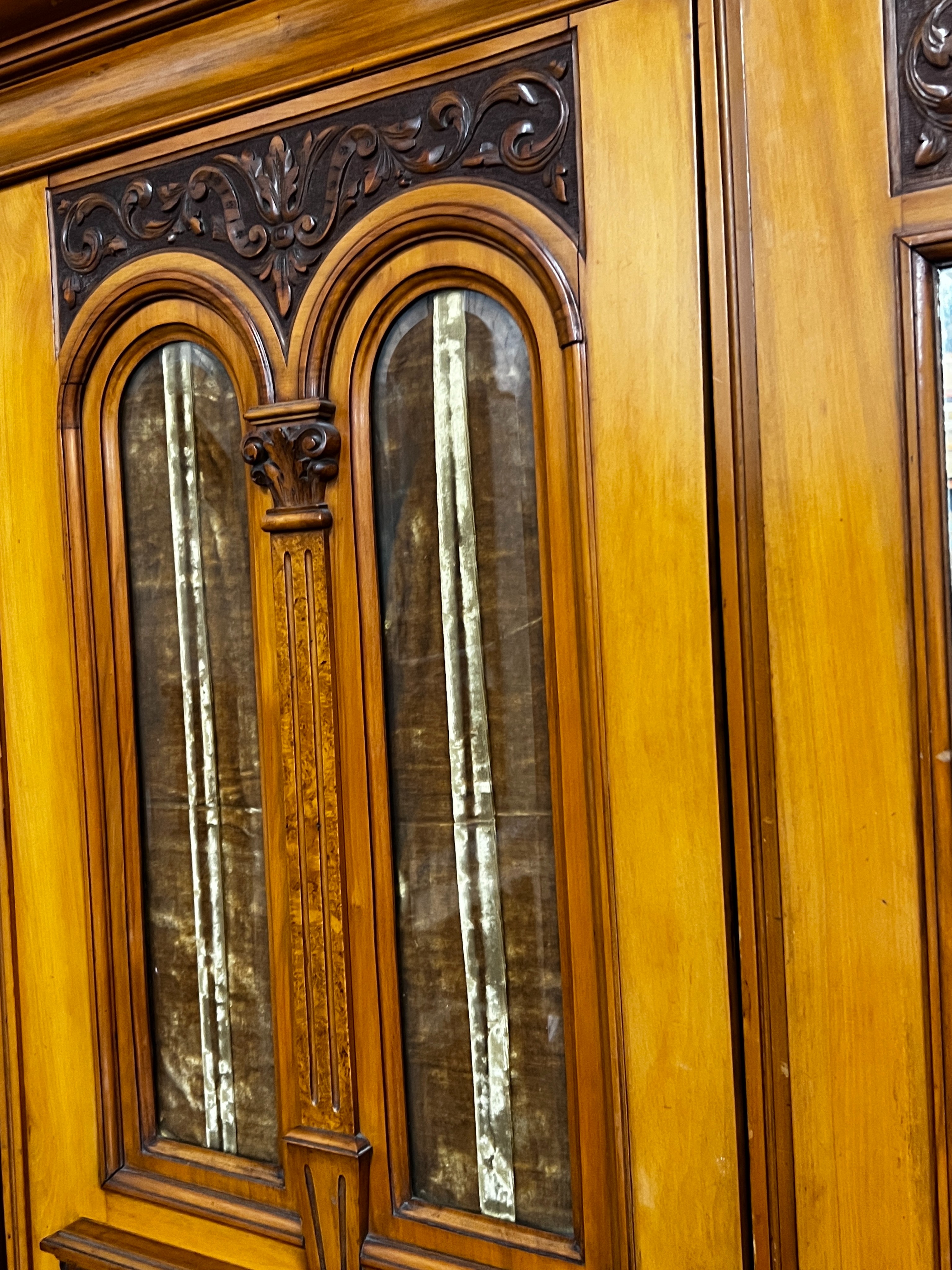 A late Victorian satin walnut and burr elm two door mirrored wardrobe, width 130cm, depth 50cm, height 210cm